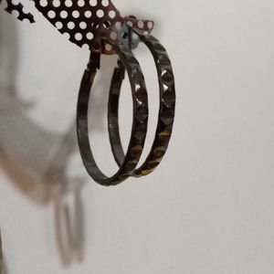 Set of steel gray studded hoops